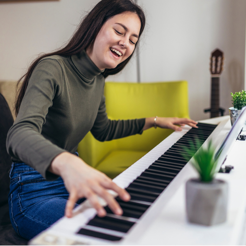 Girl playing happily keyboard