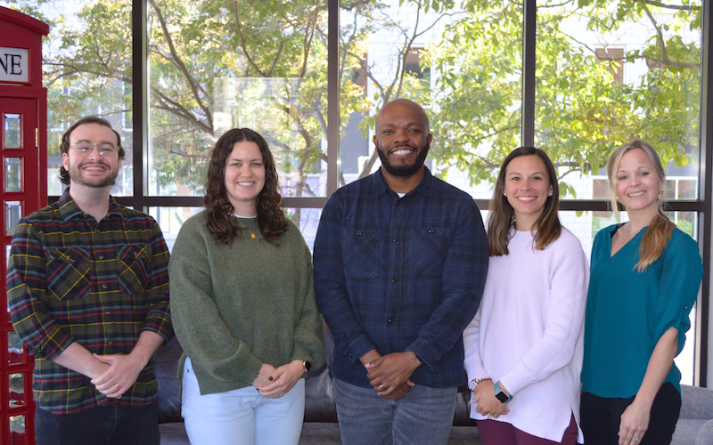 Implementation team standing together for a group photo.